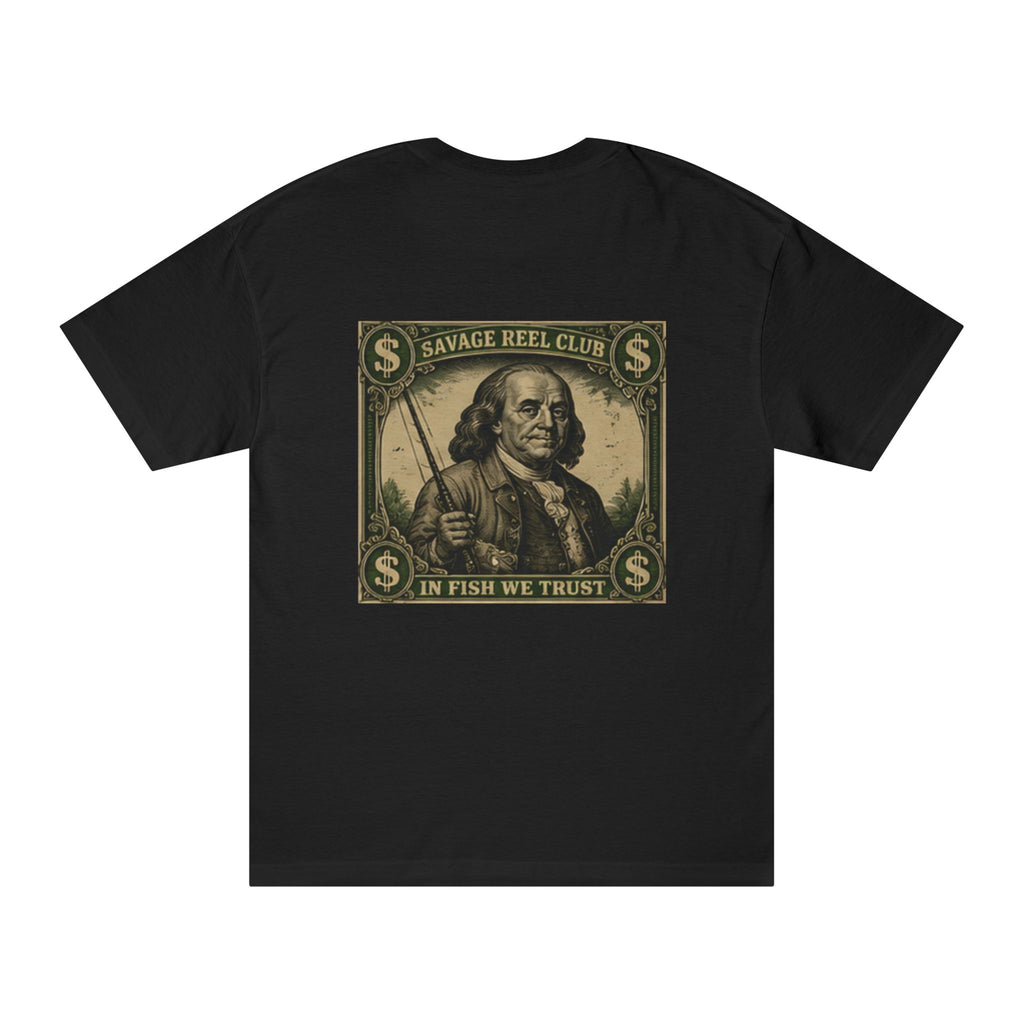 Fishing T-shirt with "Savage Reel Club: In Fish We Trust" slogan featuring Benjamin Franklin graphic, casual wear for anglers.